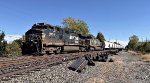 NS 9859 leads an empty sand hopper train west,